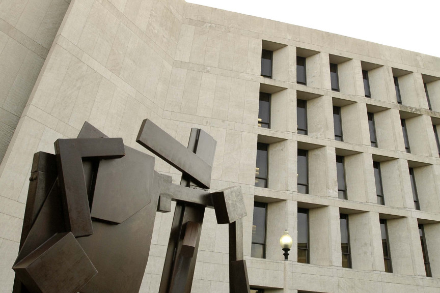 metal sculpture up against building