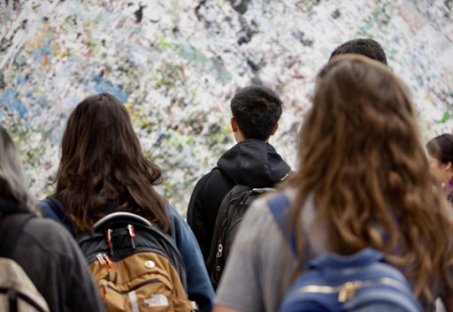 students looking at computer generated art