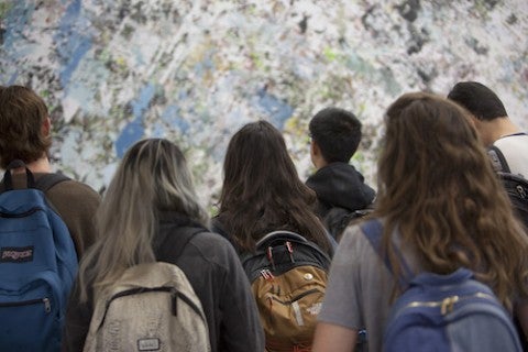 Students looking at mural