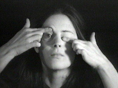 A woman manipulating her own eyelids.